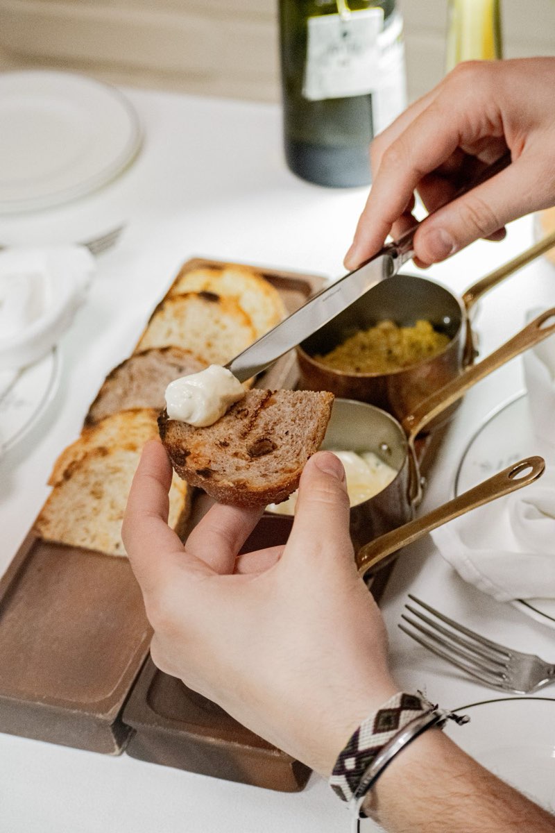 Grilled hearth bread passed by hand, smoked butter in copper pans